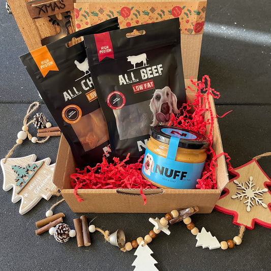dog treat christmas gift for dogs 1 all beef dog treats, 1 all chicken dog treat, 1 peanut butter blue coconut dog treat, in a christmas box with christmas deecoration